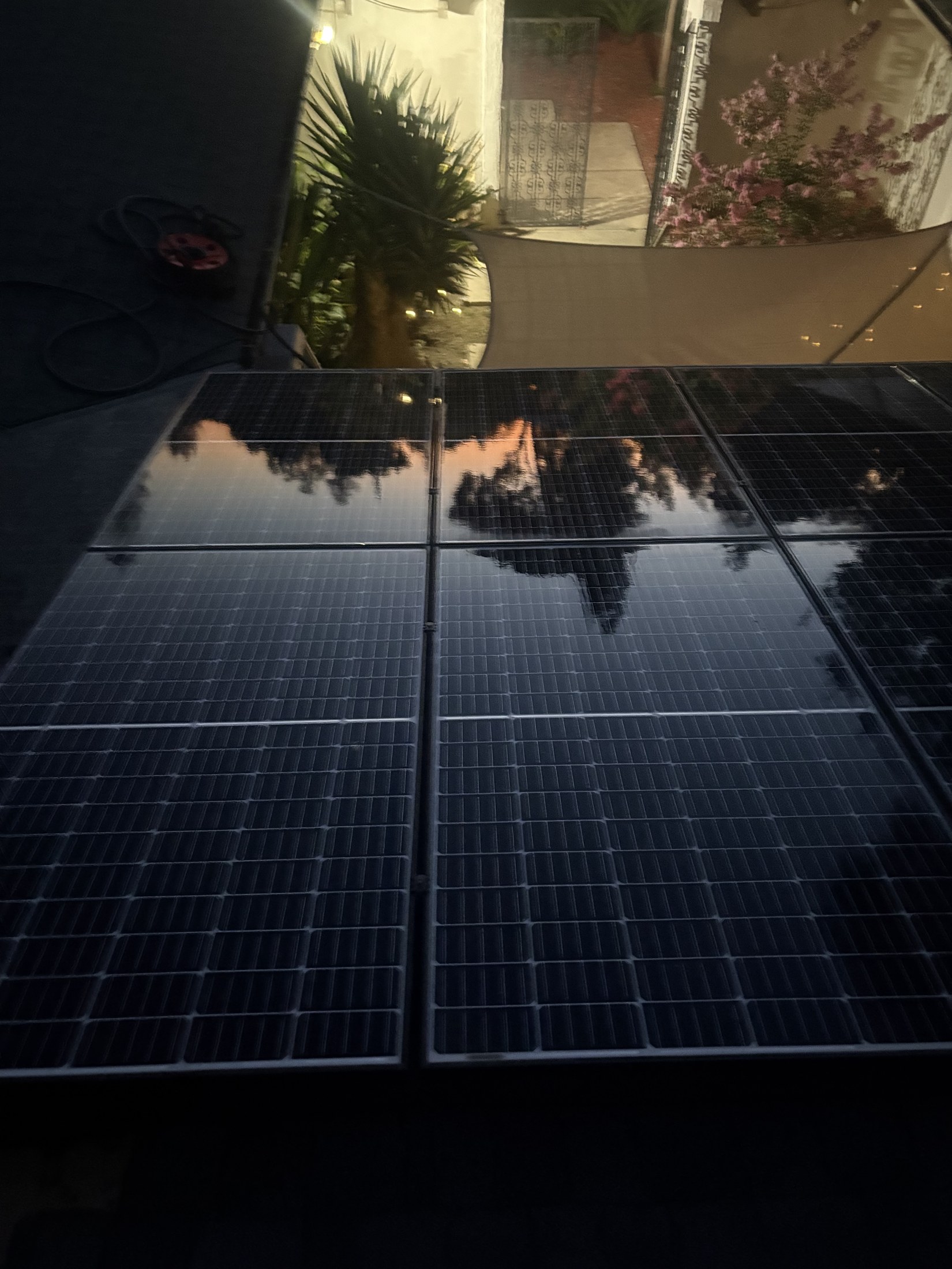 Macro close-up of a spotless solar panel with a mirror-clean reflective surface after cleaning.